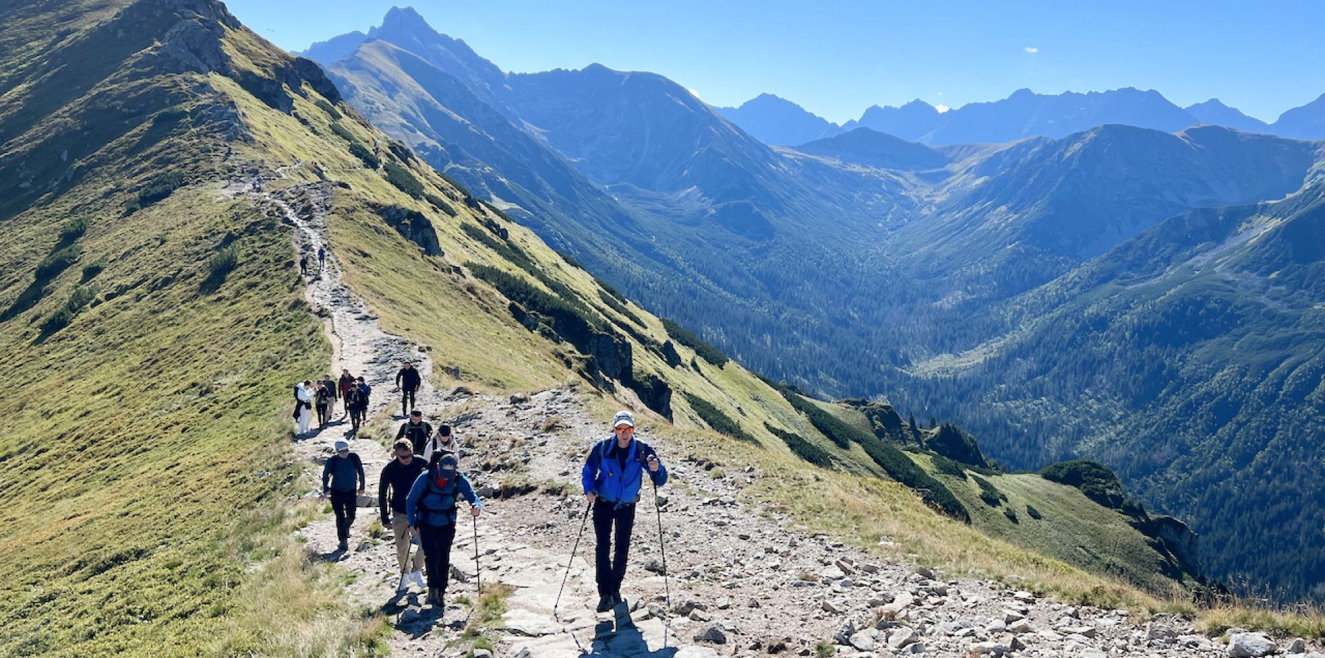 Engenious team hiking along a mountain trail